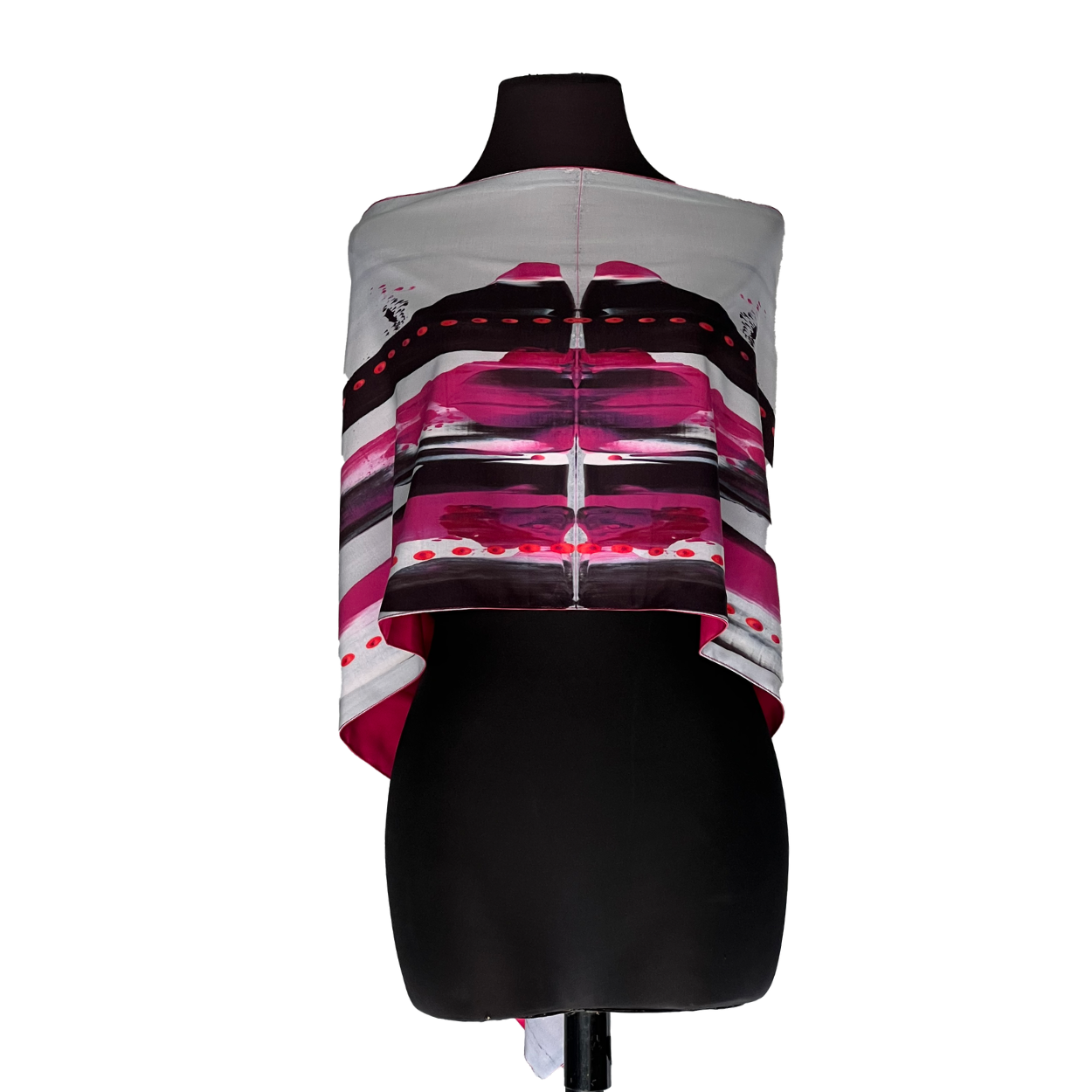 Mannequin wearing a white top with pink and black striped graphic and black skirt
