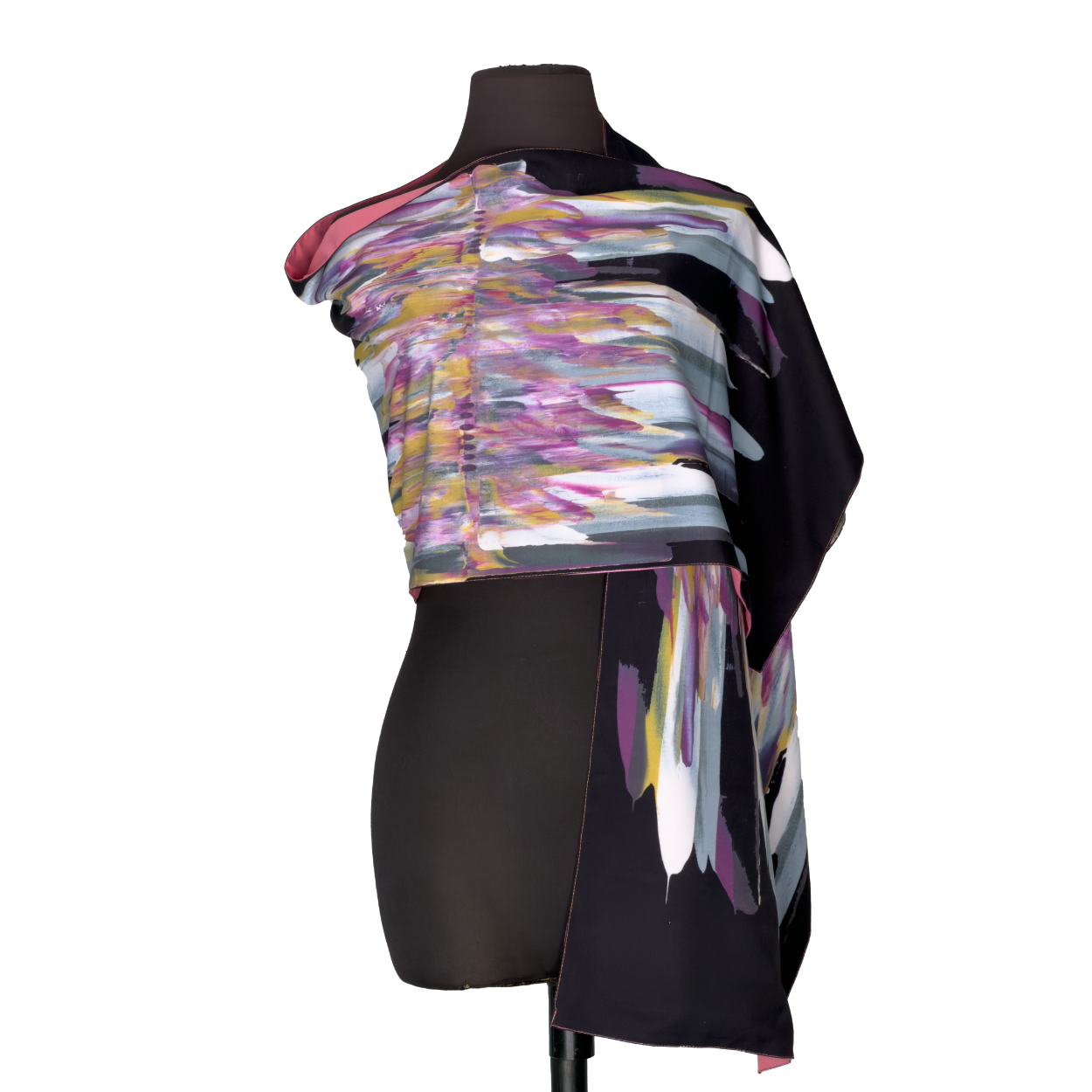 Abstract multicolor asymmetrical dress on a mannequin, with black draped panels