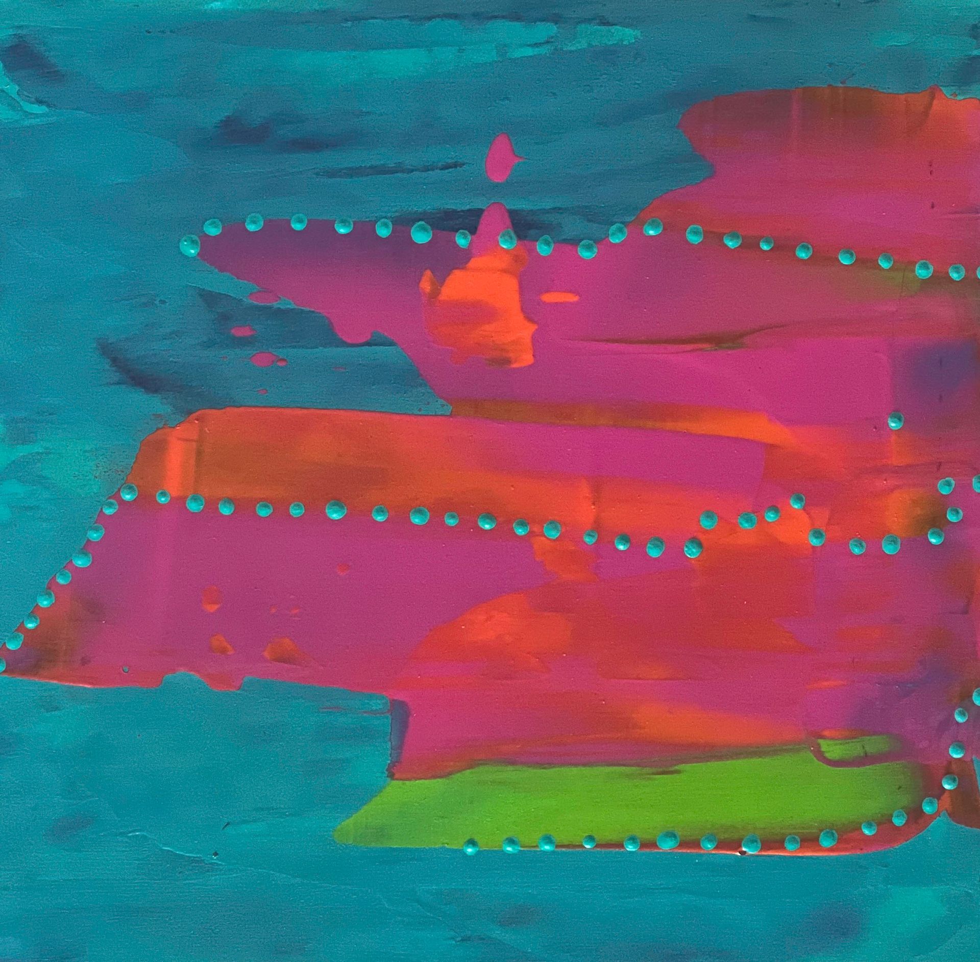 Colorful abstract silk crop top on a black mannequin.