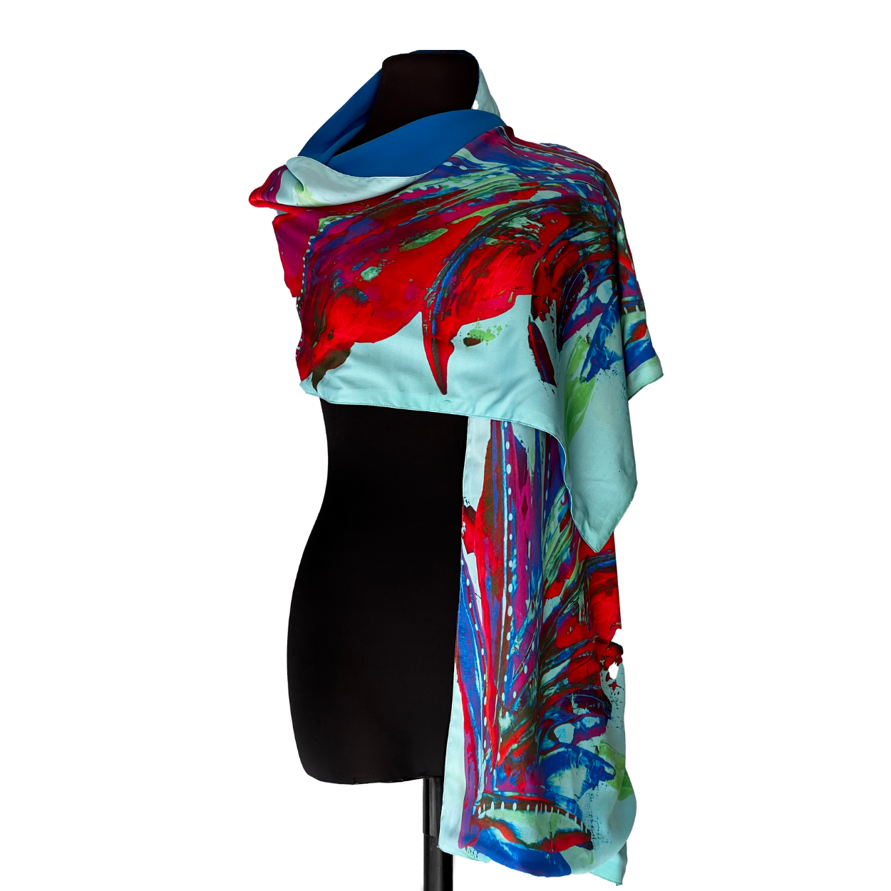 Silk scarf with abstract red and blue floral design draped over a black mannequin.