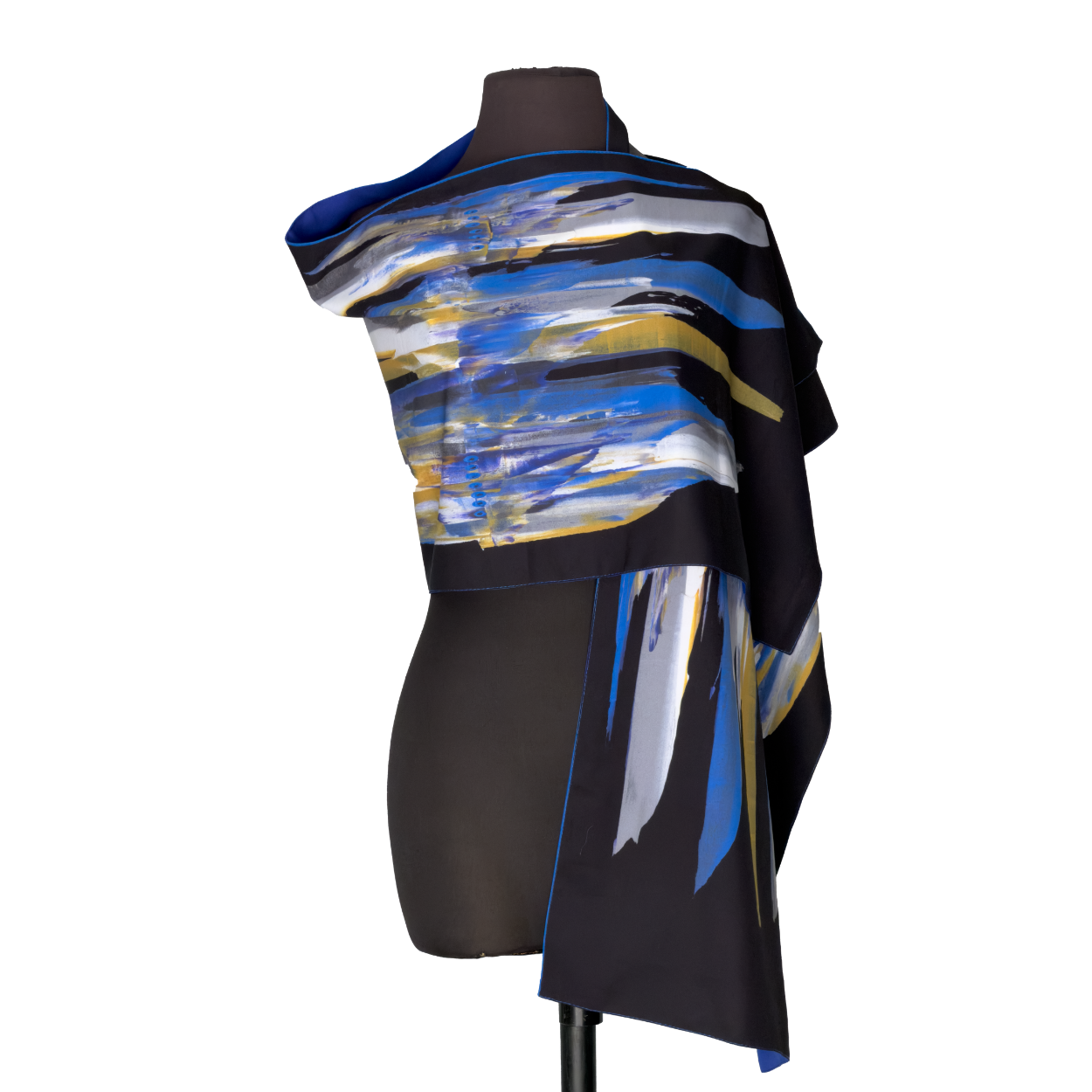 Abstract blue, black, and white draped garment on a mannequin against a white background