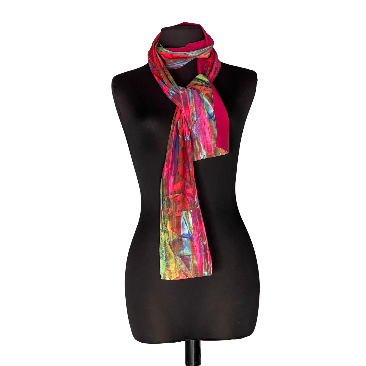 Black dress form wearing a colorful pink-red patterned scarf on a white background