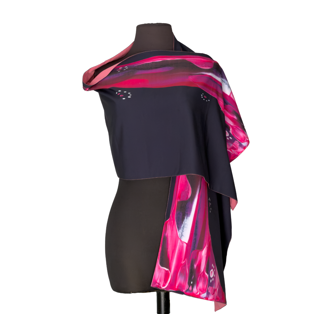 Black mannequin wearing a draped black dress with bright pink abstract accents