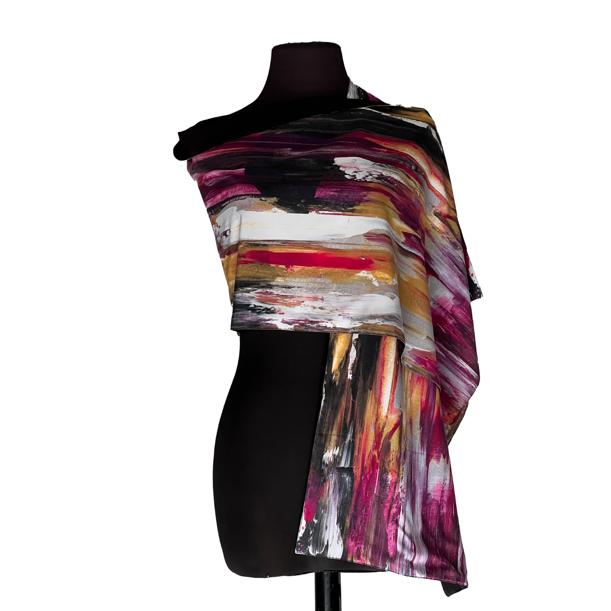 Abstract multicolor striped shawl draped over a black mannequin torso