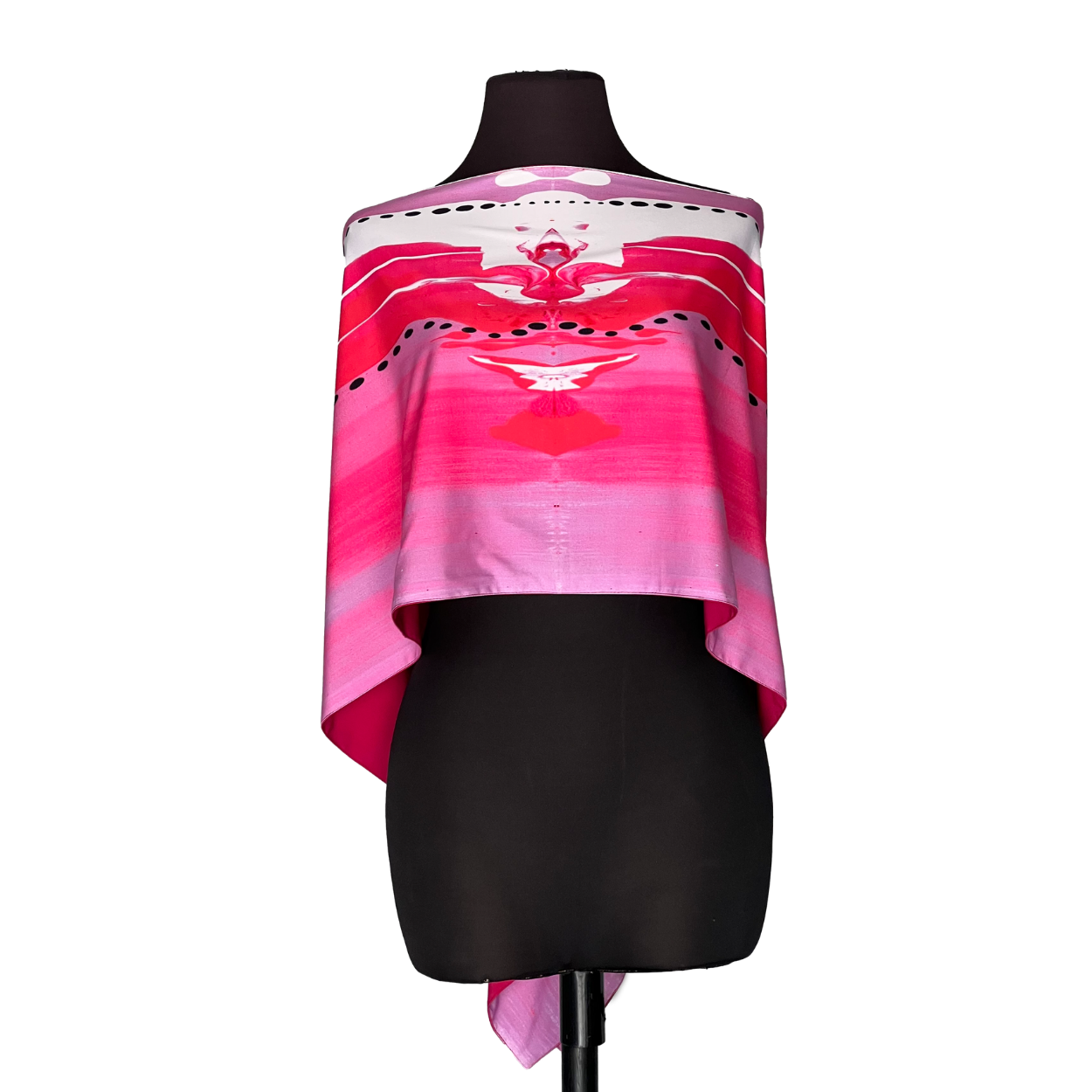 Black mannequin wearing a pink patterned off-shoulder top and black skirt