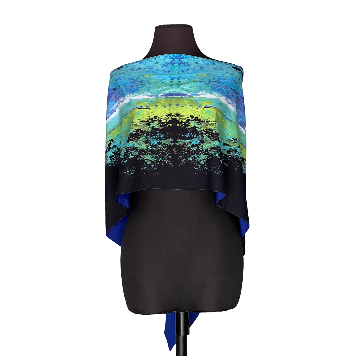 Blue and green patterned shawl draped over a black mannequin torso