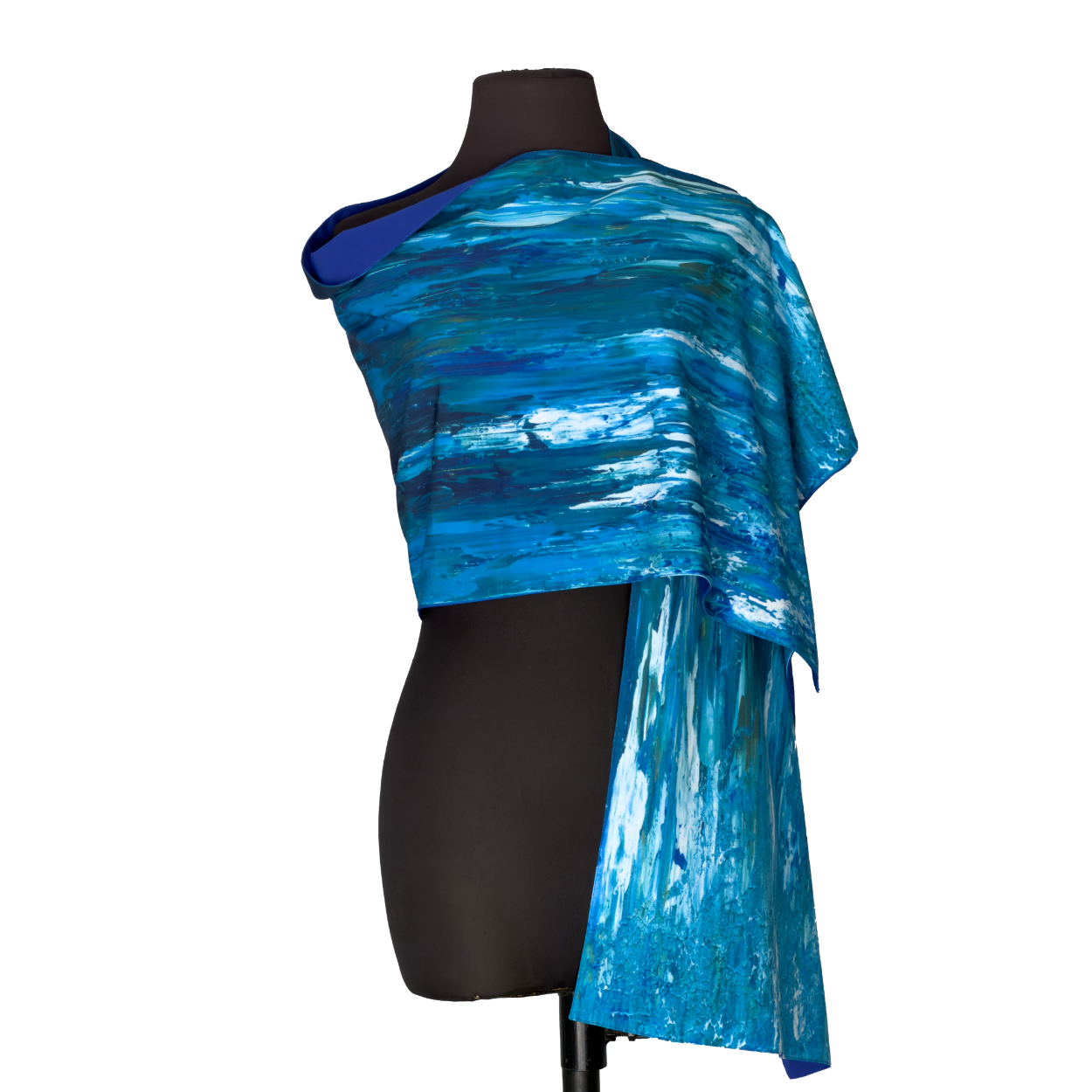 Blue asymmetrical draped top on a black mannequin with a long hanging sleeve
