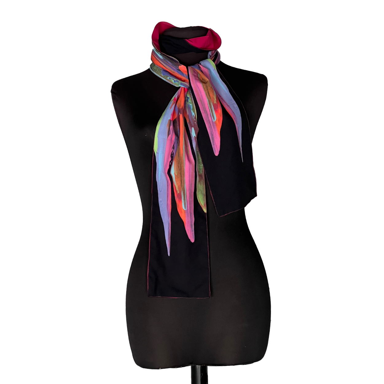 Black mannequin displaying a colorful striped scarf on a black stand