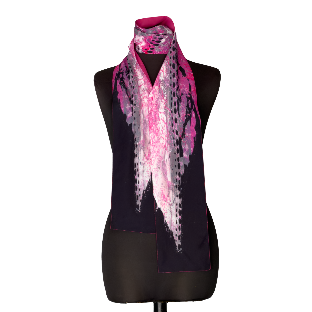 Black mannequin wearing a pink and purple patterned scarf over a dark top