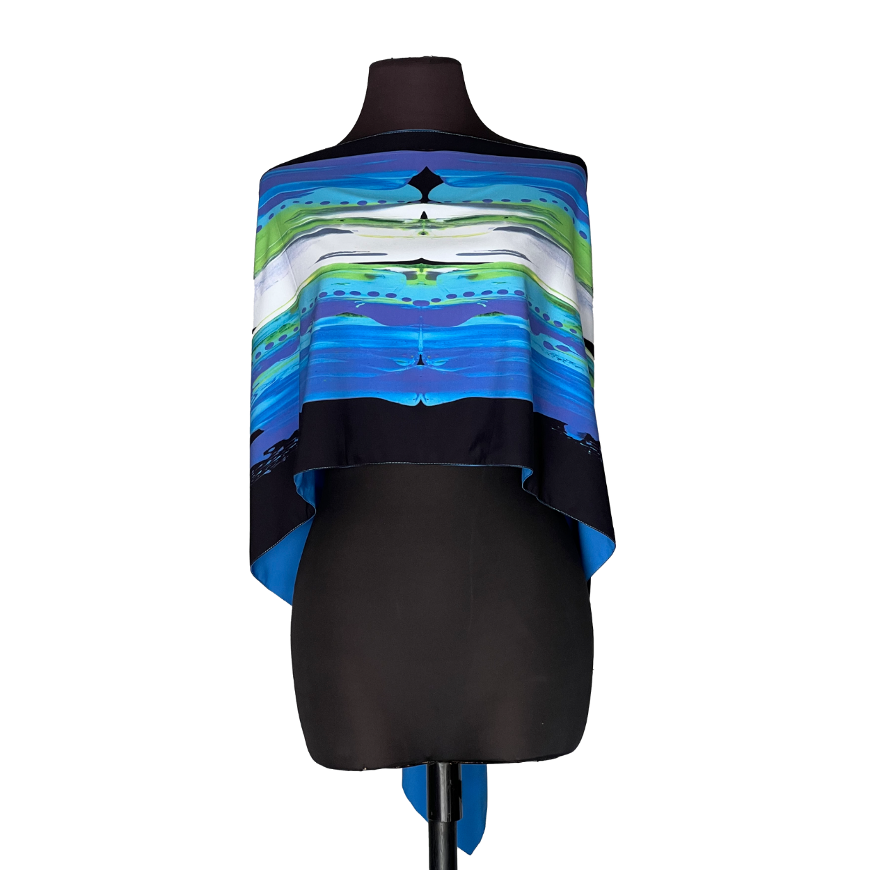 Black mannequin wearing a blue, green, and white striped poncho top