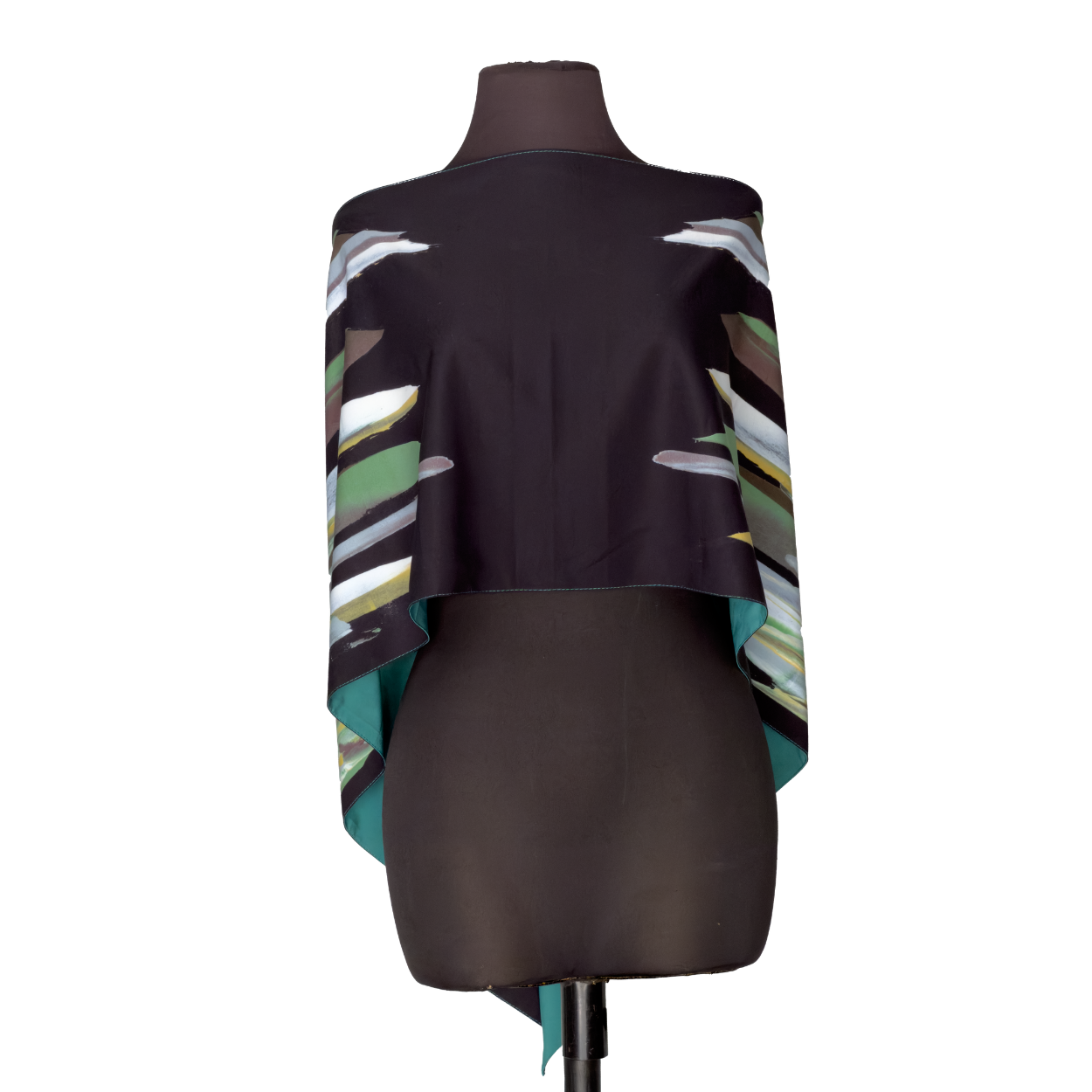 Black cape-style top with colorful striped sleeves on a dress form