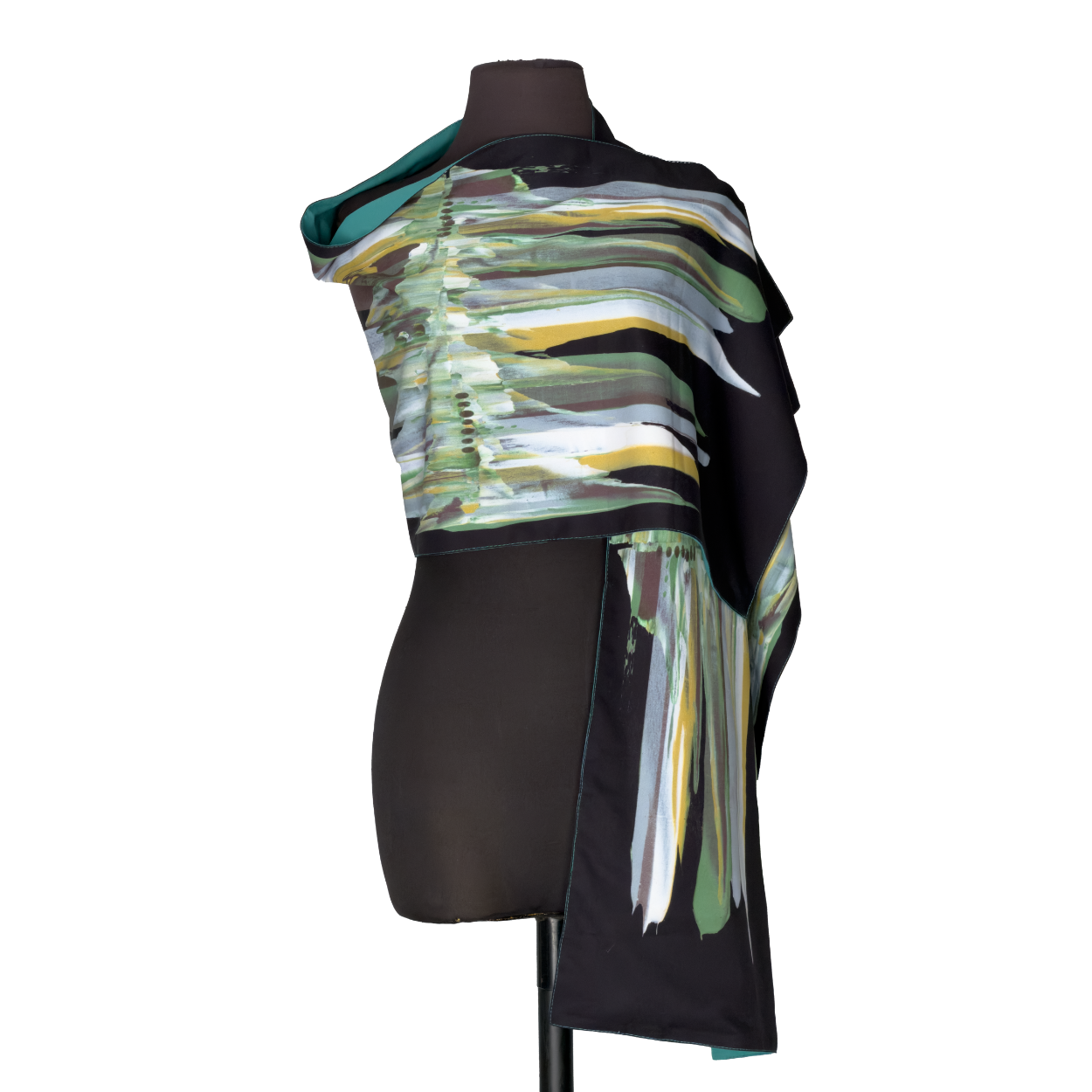 Colorful layered scarf draped over a black dress form on a white background