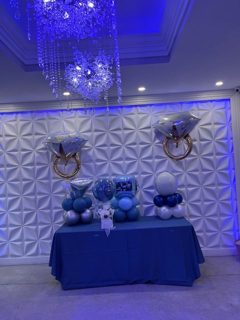 Balloon table displays created by My Life In Balloons LLC with large diamond ring foil balloons, pearlized orbs, and denim-toned accents. Ideal for bridal showers, birthdays, or engagement parties.
