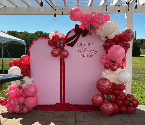 “She’s the Cherry on Top” bridal shower balloon decor at The Blue Cork Winery in Williamstown, NJ by My Life In Balloons LLC. Elegant balloon garlands, cherry balloons, and custom backdrop design.