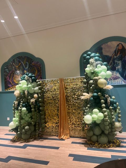 Green balloon tree columns and gold sequin backdrop by My Life In Balloons LLC for prom at Showboat, Atlantic City.