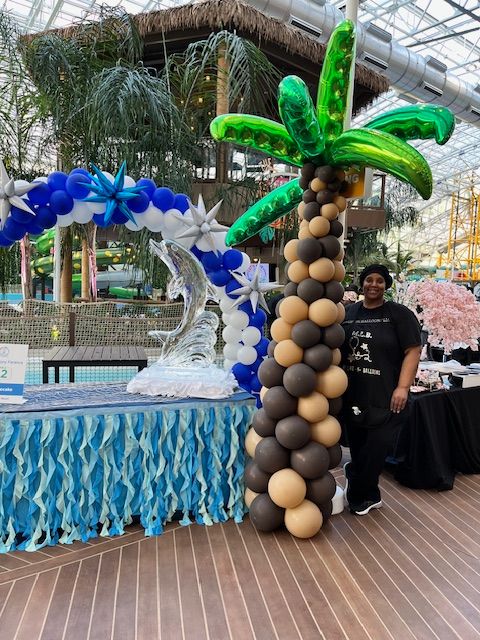 Palm tree balloon column with vibrant swirl towers by My Life In Balloons LLC for the Let’s Get Cookin’ 2024 event at Showboat, Atlantic City.