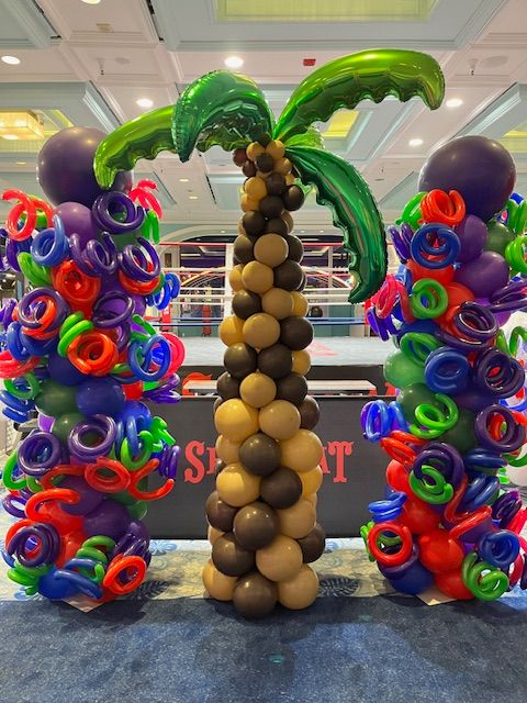Palm tree balloon column with vibrant swirl towers by My Life In Balloons LLC for the Let’s Get Cookin’ 2024 event at Showboat, Atlantic City.