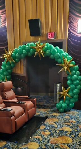 Balloon arch inside a movie theater auditorium for TD Bank Wild Stars Celebration 2025.