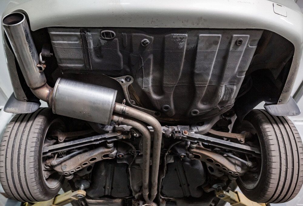 A Close up Of the Underside of A Car with A Exhaust Pipe — Tweed Exhaust & Mechanical In Tweed Heads South, NSW