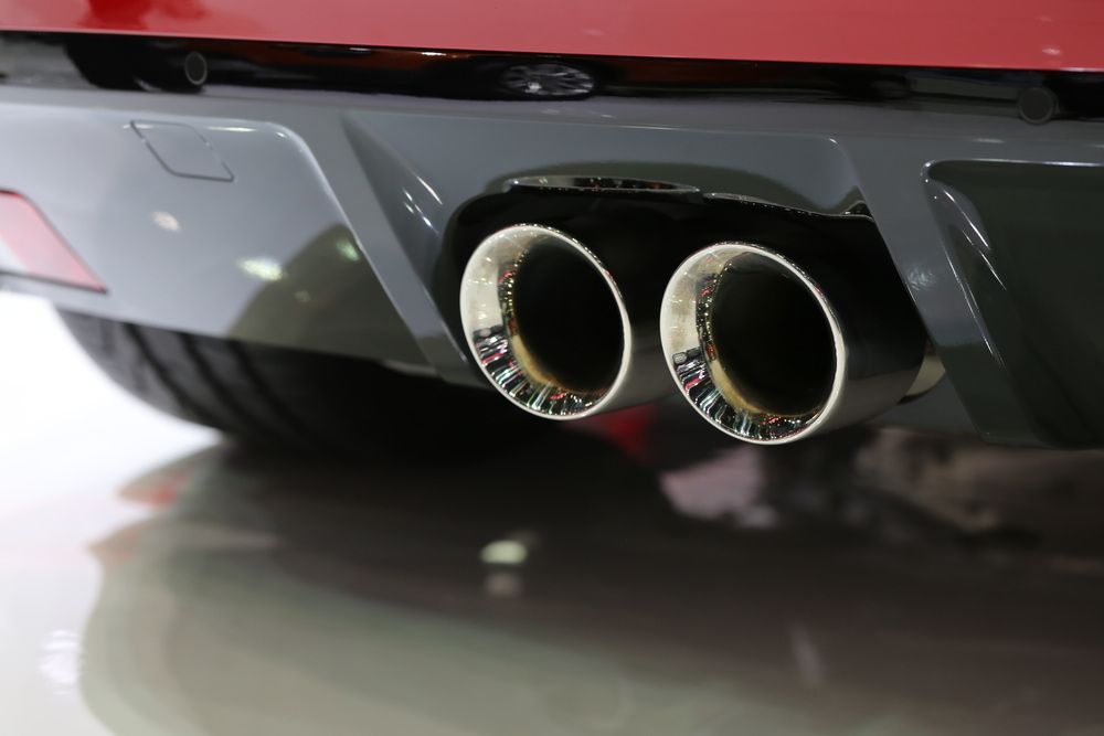A Close up Of the Exhaust Pipes of A Red Car — Tweed Exhaust & Mechanical In Tweed Heads South, NSW