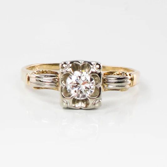 Vintage orange blossom round natural diamond engagement ring.