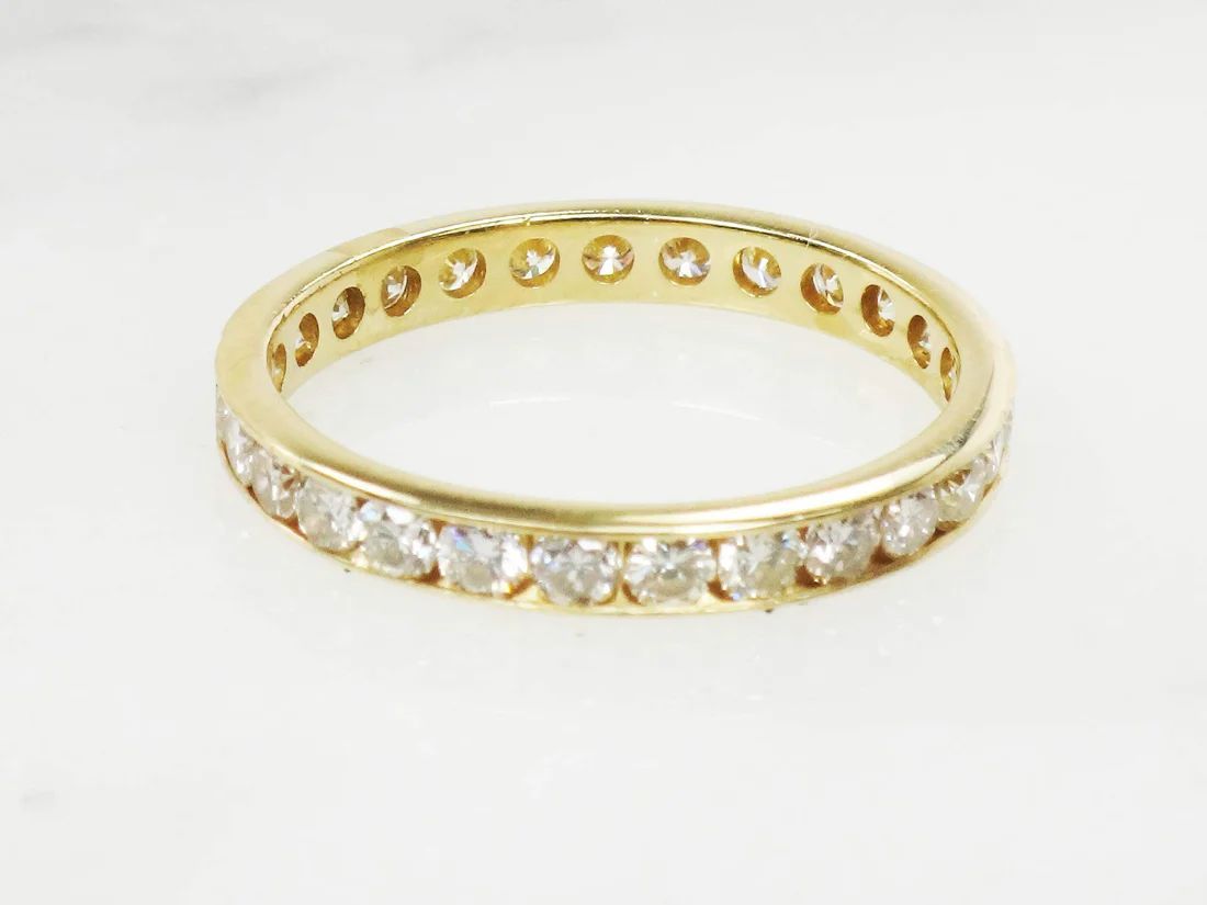Yellow gold diamond wedding band in an eternity style