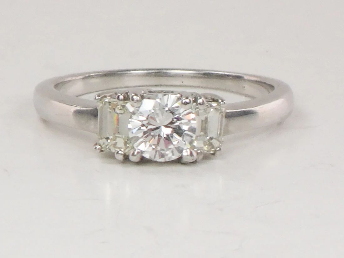 White gold round natural diamond engagement ring.