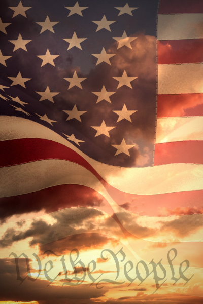 A soldier in a helmet is holding an american flag.