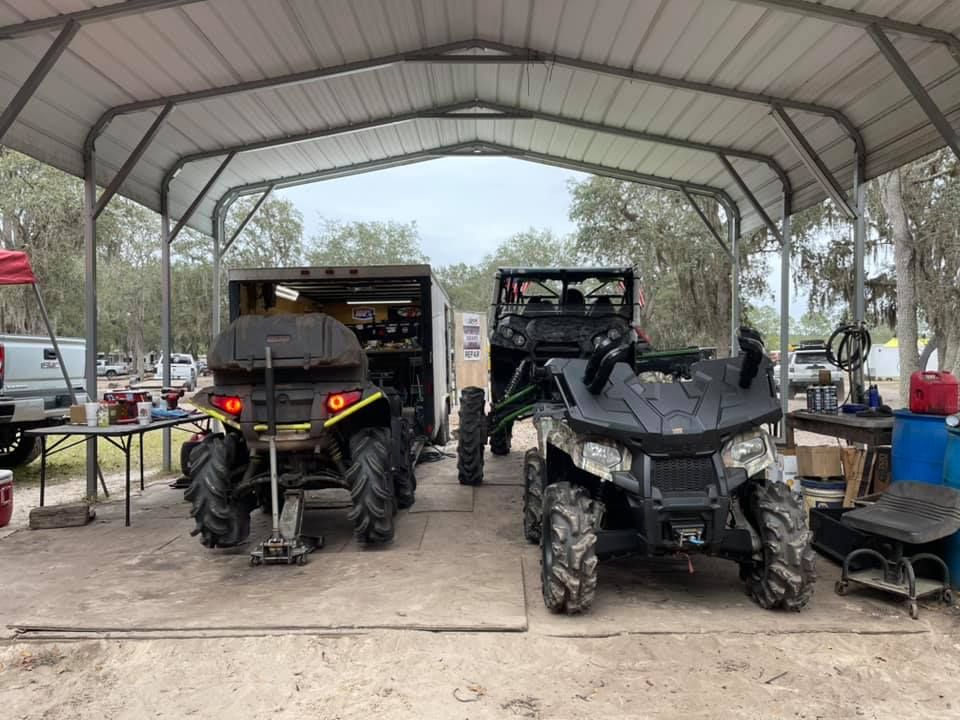 Two vehicles are parked under a covered area — St. Augustine, FL — Wide Open Mobile Tech