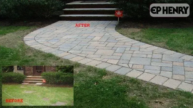 A paved walkway and steps leading to a house, 