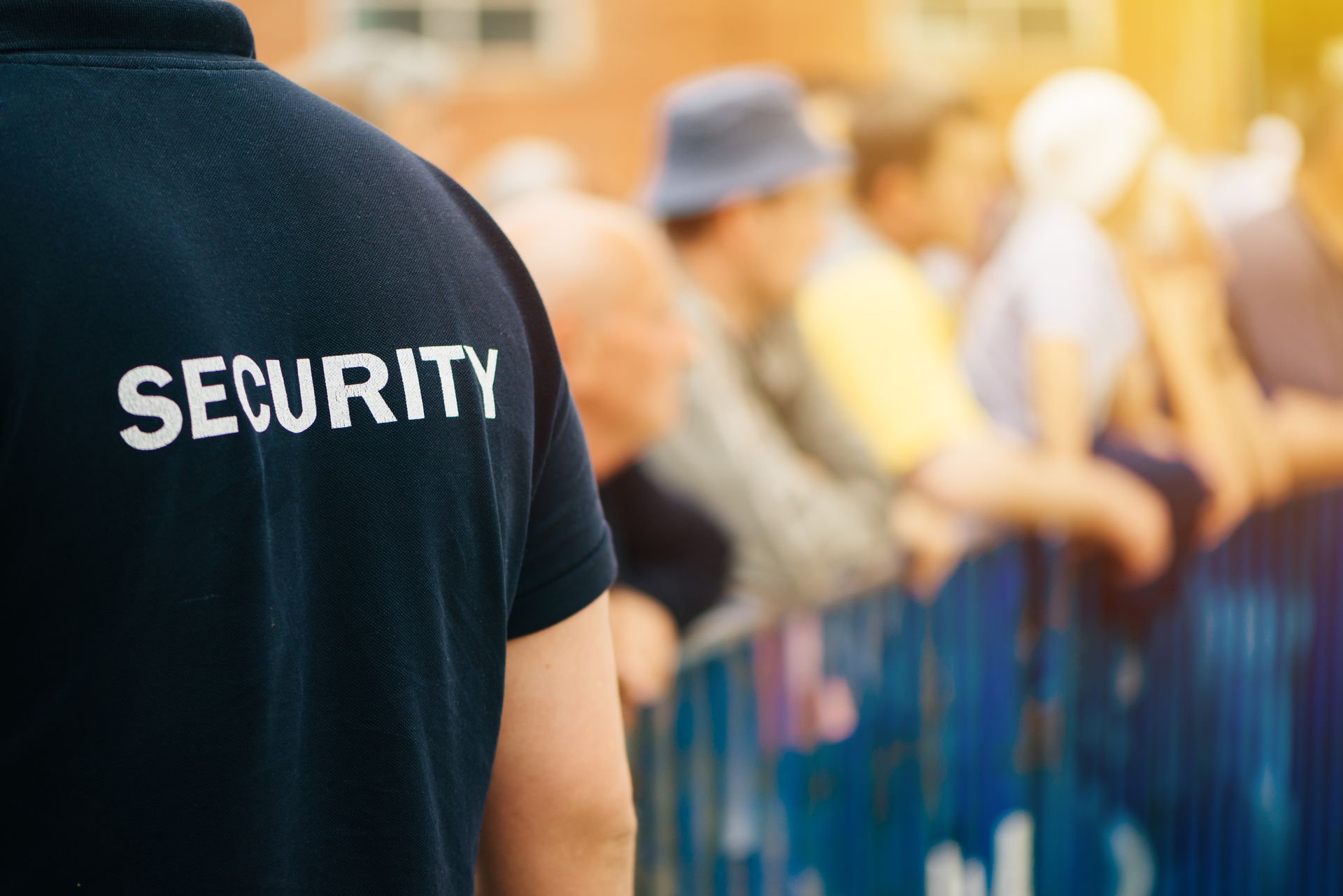 Close-up of a guard providing event security services to ensure safety at a public crowd.
