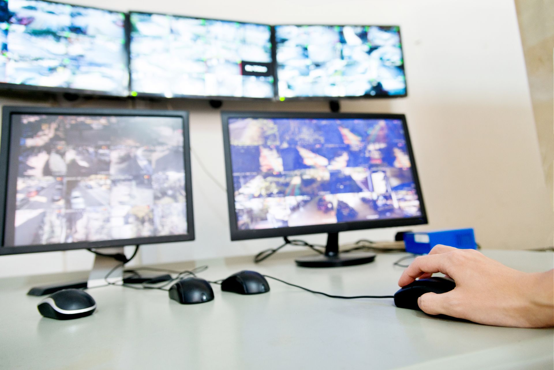 Monitors displaying activity, showcasing full-service security solutions in action.