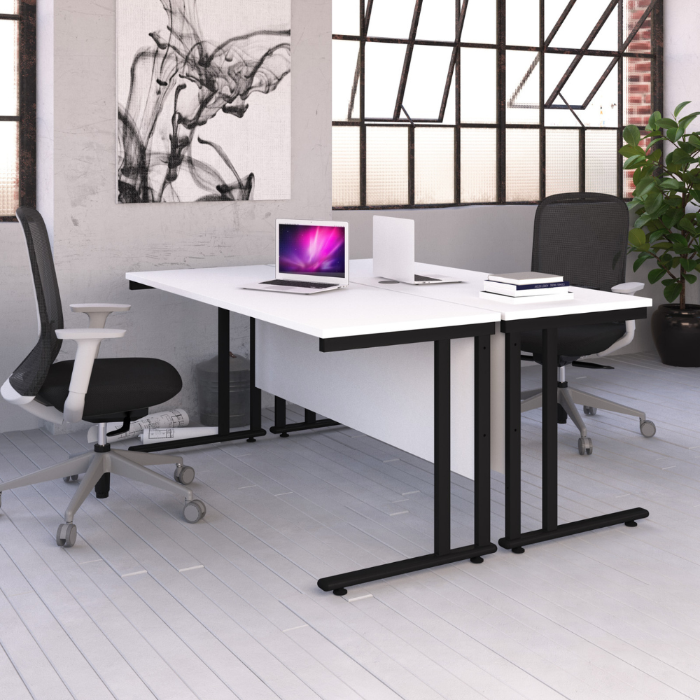 a white desk with a laptop on it and a black chair