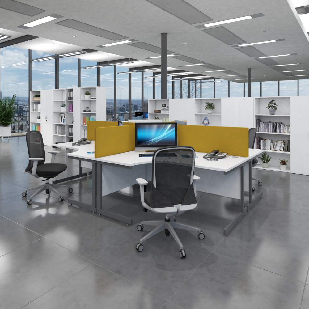 a computer is on a desk in a large office