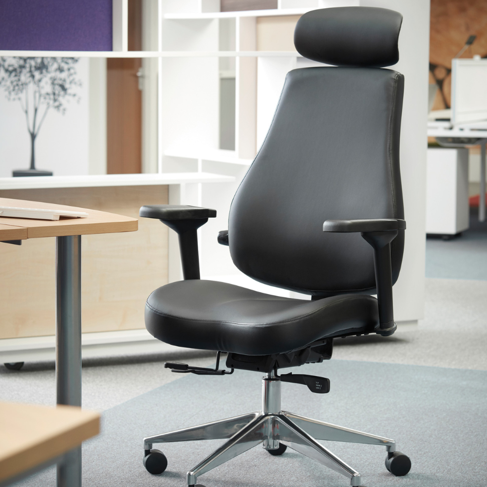 a black office chair is sitting in front of a desk