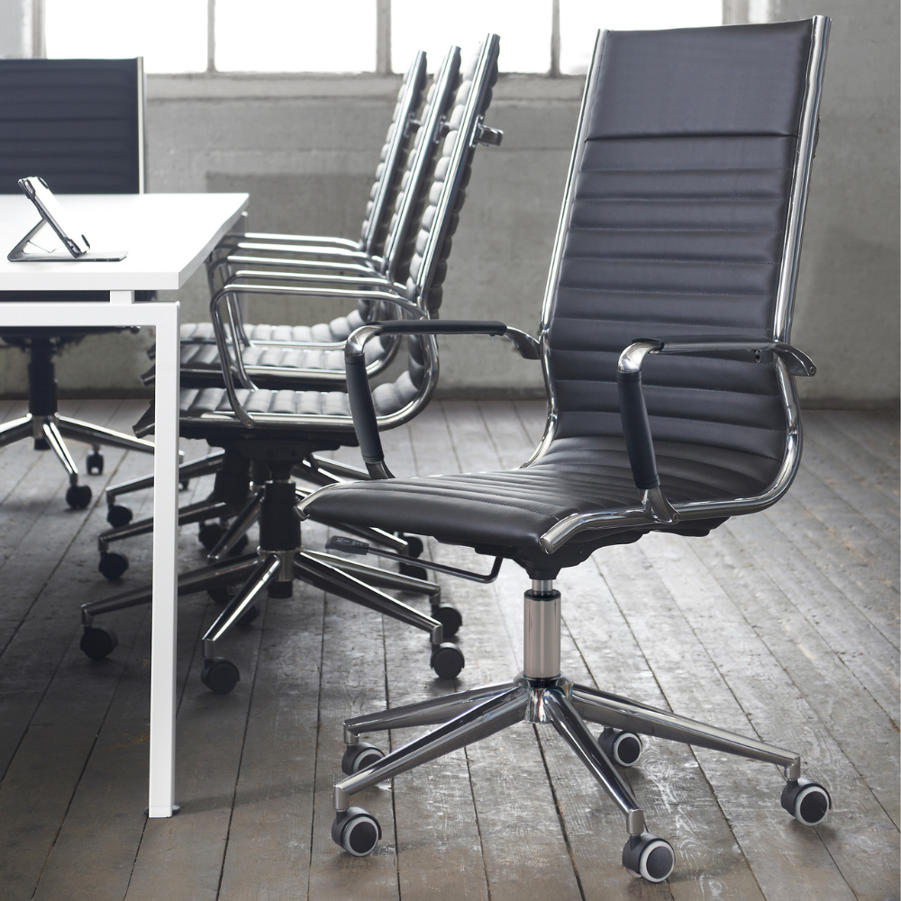 a row of office chairs are lined up in front of a table