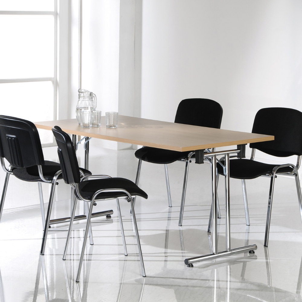 a table with four chairs and a pitcher of water on it