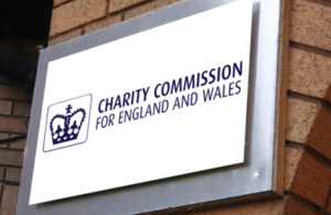 A sign for the charity commission for england and wales