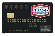 AAMCO black credit card with chips, logo, and gold text for car care rewards