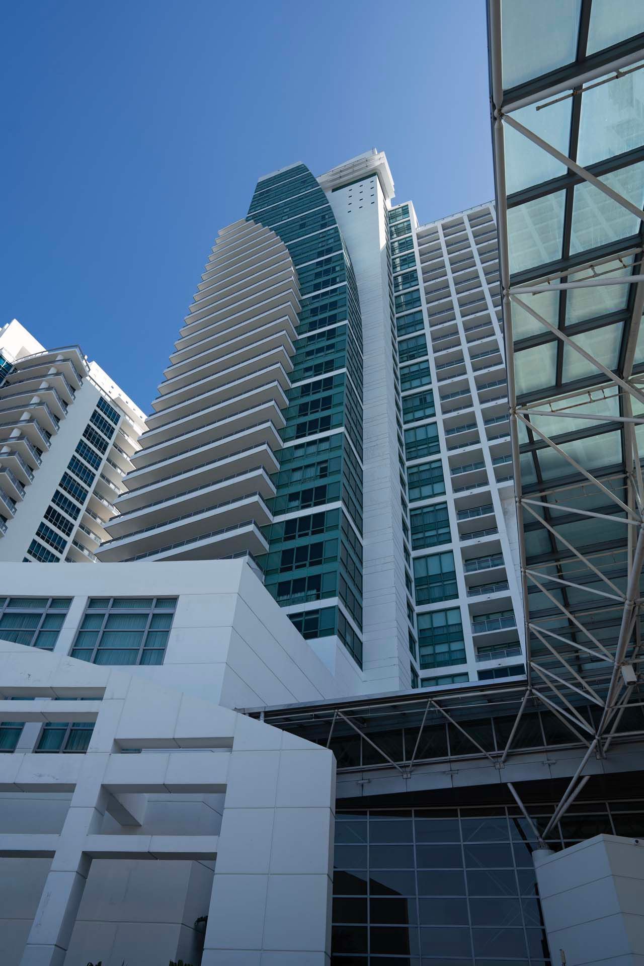 Looking up at a tall building with a blue sky in the background