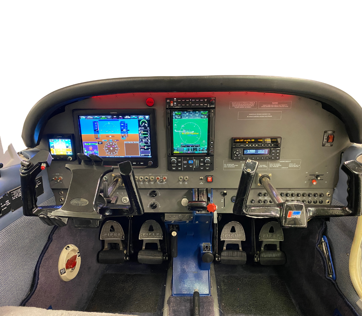 Aircraft cockpit with digital displays, controls, and instruments. Grey panel, blue interior.