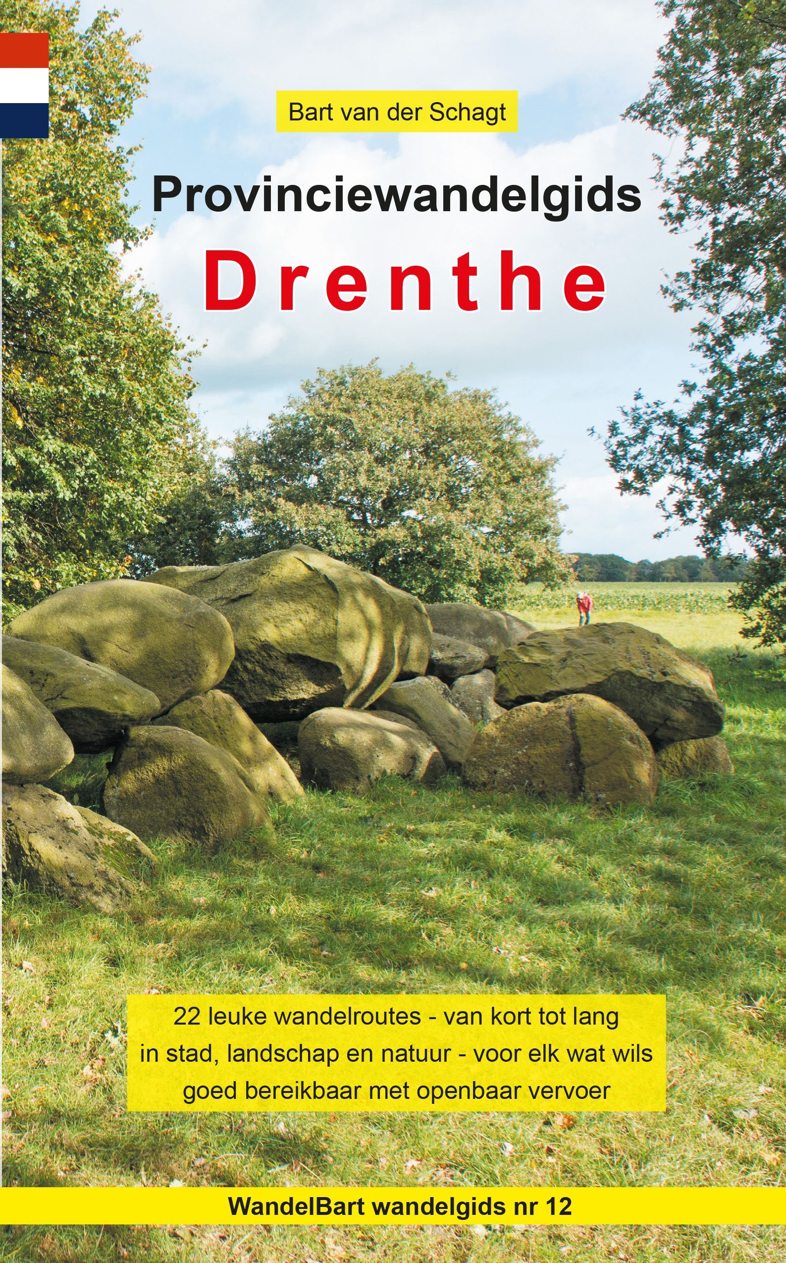 Provinciewandelgids Drenthe reisgidsomslag. Een stenen constructie in een veld met groene bomen en tekst.