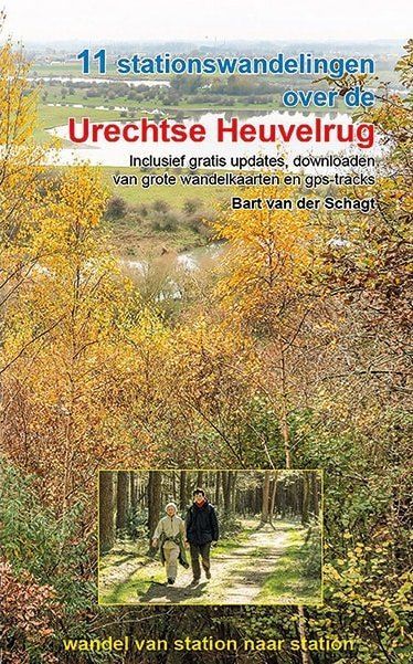 Book cover for "11 stationswandelingen over de Utrechtse Heuvelrug." Two people walking in a forest.
