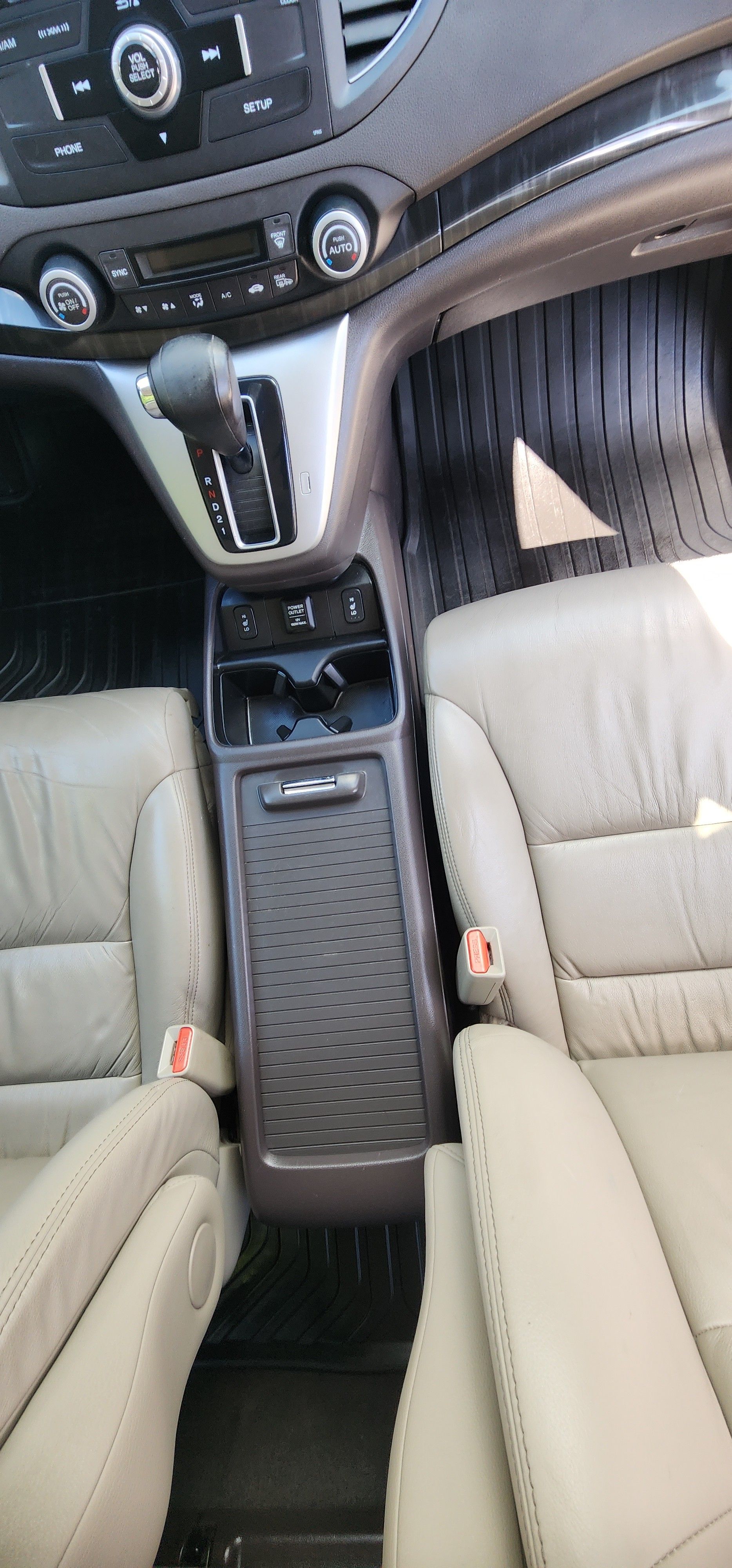 A close up of the interior of a car with leather seats.