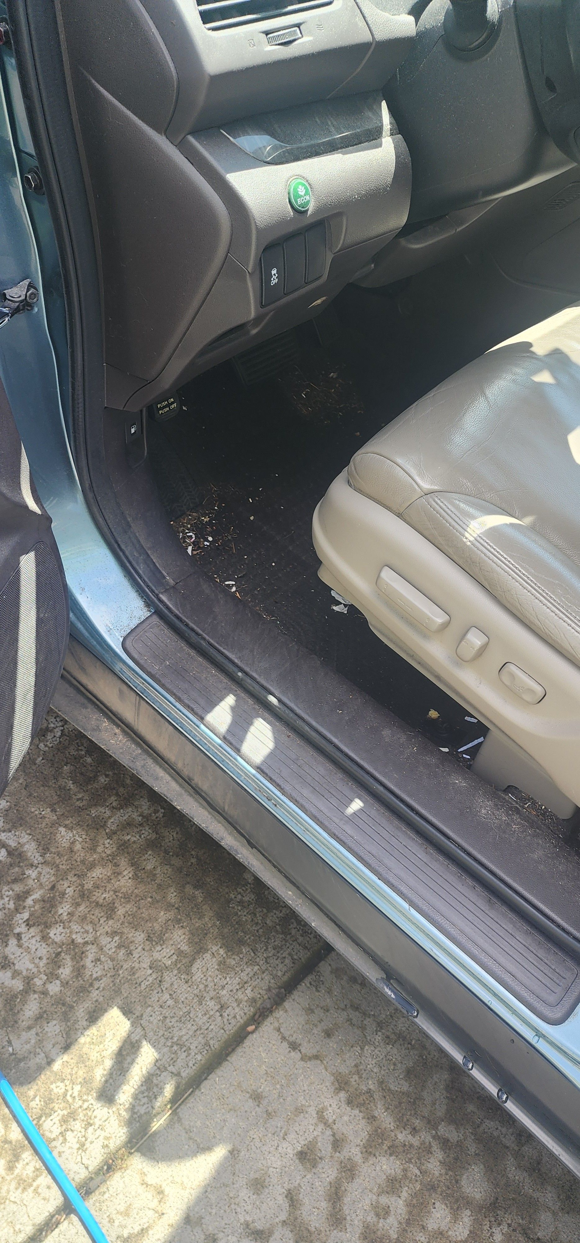 A close up of the inside of a car with the door open.