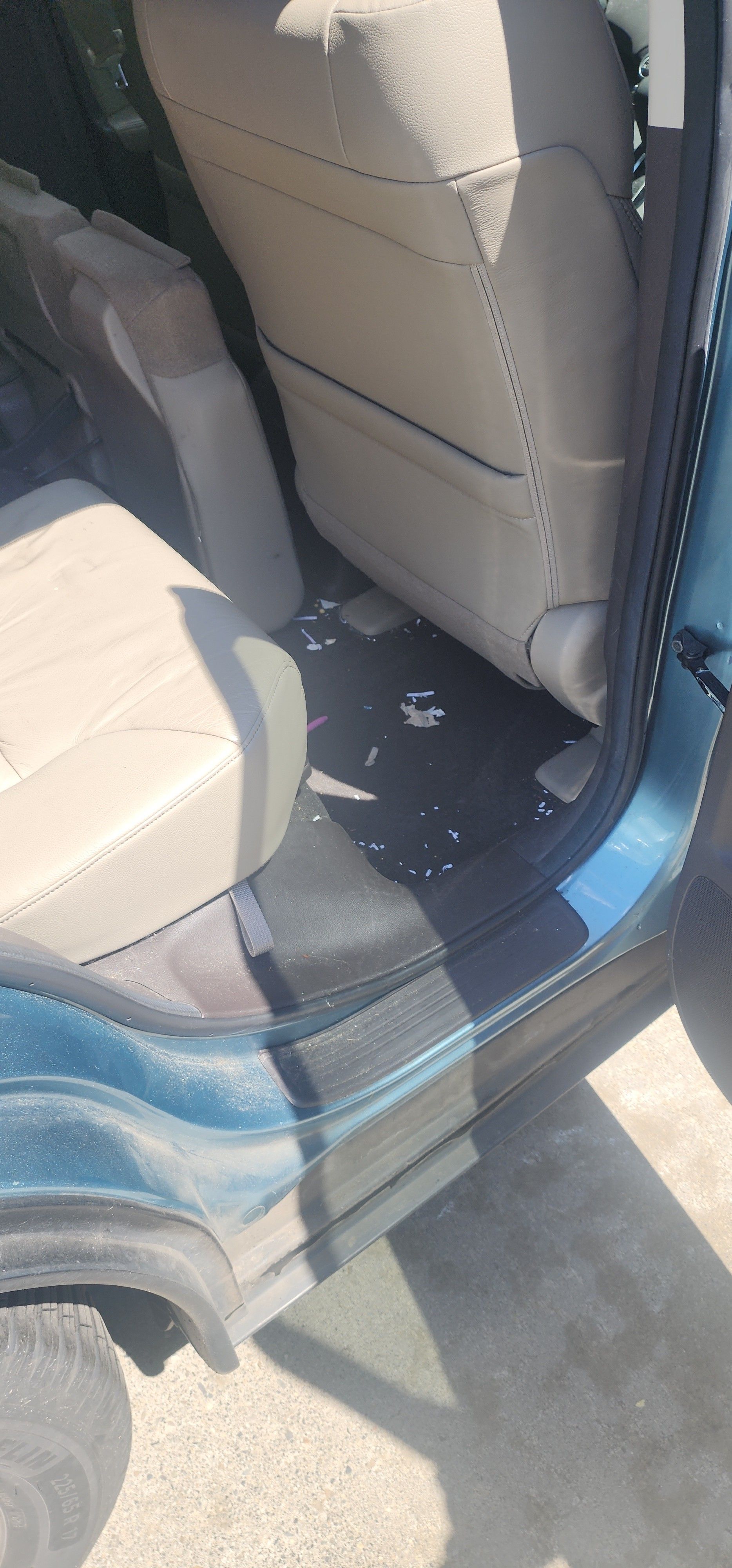 A close up of the inside of a car with the door open.