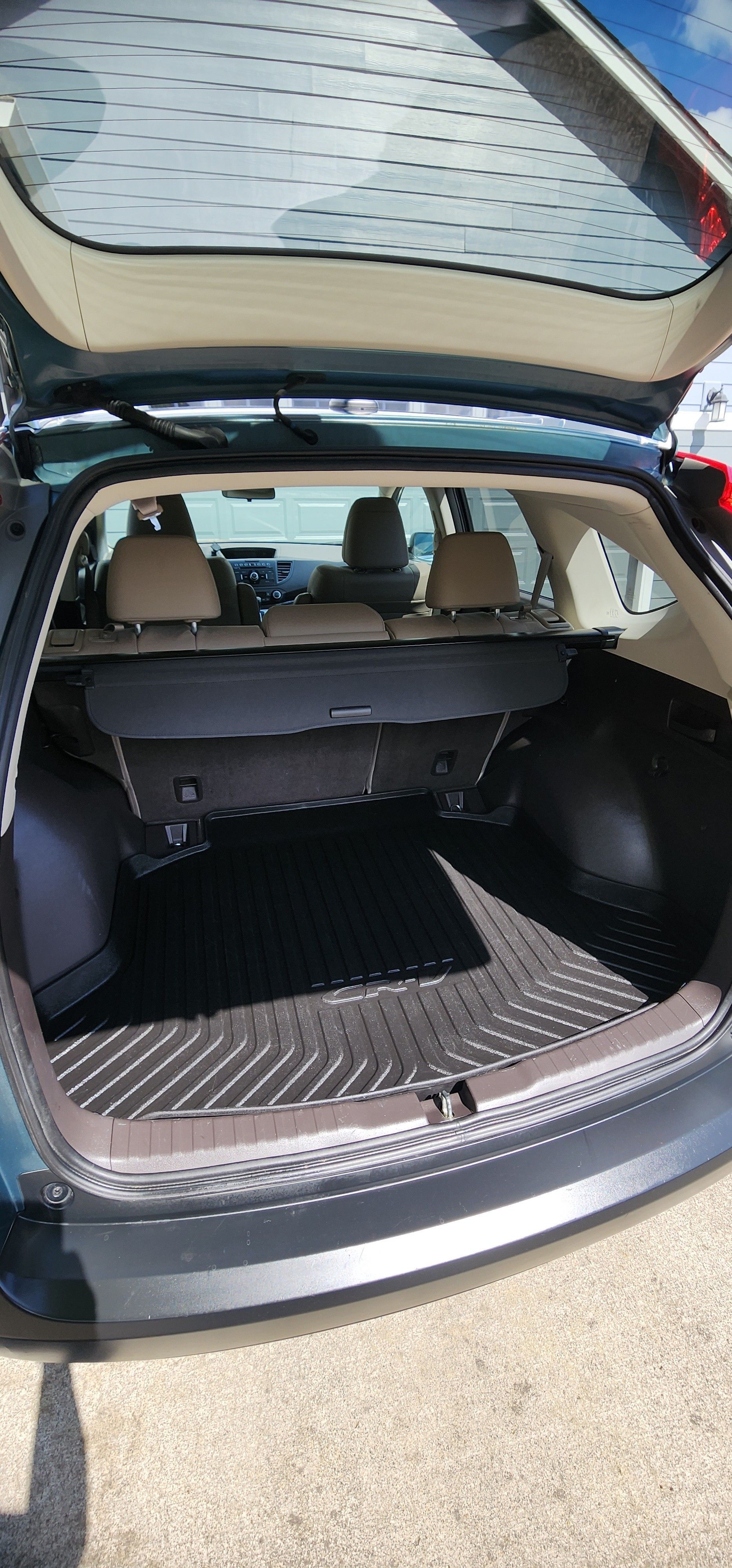 The back of a car with the trunk open.