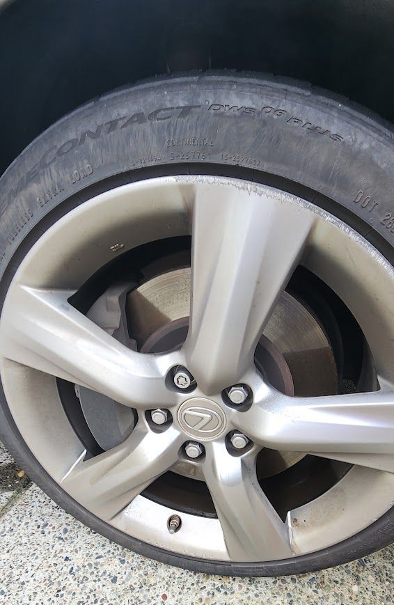 A close up of a car wheel with a tire on it.
