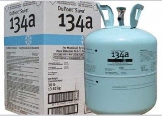 Cilindro de refrigerante azul DuPont 134a junto a su caja sobre un fondo blanco.
