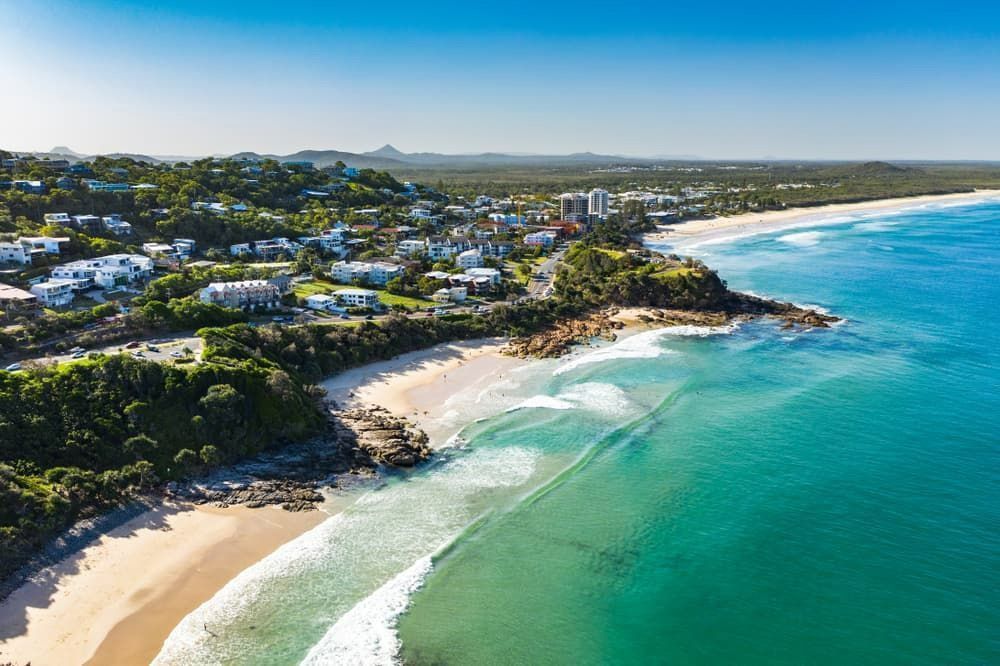 An Aerial View Of A Beach With A City In The Background — Branch Manager Tree Services Coolum Beach In Sunshine Coast, QLD